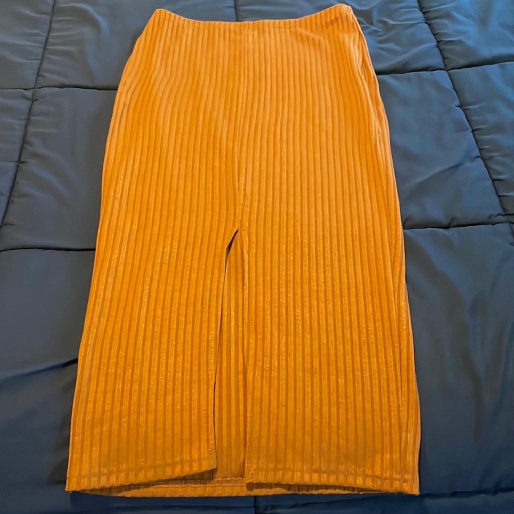 Rust orange rubbed skirt. With front slit.